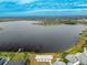 Aerial view of a lake with a community at 11550 Lake Lucaya Dr, Riverview, FL 33579