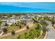 Aerial view of a two-story house with a large backyard and a three-car garage in a quiet community at 11550 Lake Lucaya Dr, Riverview, FL 33579