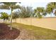 Landscaped backyard with a large pool and a privacy fence at 11550 Lake Lucaya Dr, Riverview, FL 33579