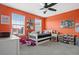 bedroom with a bed, toys, and colorful walls at 11550 Lake Lucaya Dr, Riverview, FL 33579