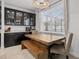 Kitchen dining area with rustic wood table and bench seating at 11550 Lake Lucaya Dr, Riverview, FL 33579