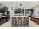 Modern kitchen with dark cabinetry, island, and stainless steel appliances at 11550 Lake Lucaya Dr, Riverview, FL 33579