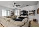 Relaxing living room with large sectional sofa and built-in shelving at 11550 Lake Lucaya Dr, Riverview, FL 33579