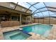 Large pool and spa with covered patio and seating at 11550 Lake Lucaya Dr, Riverview, FL 33579