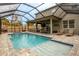 Expansive pool and spa with covered patio and seating at 11550 Lake Lucaya Dr, Riverview, FL 33579