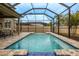 Relaxing pool area with lounge chairs and covered patio at 11550 Lake Lucaya Dr, Riverview, FL 33579