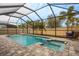 Inviting pool and spa with a covered patio at 11550 Lake Lucaya Dr, Riverview, FL 33579