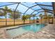 Enclosed pool and spa area with a covered patio at 11550 Lake Lucaya Dr, Riverview, FL 33579