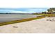 Sandy beach with chairs and lake view at 11550 Lake Lucaya Dr, Riverview, FL 33579