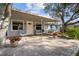 Charming home with a covered patio and brick pavers at 1159 Stewart Dr, Dunedin, FL 34698