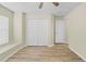 Bright bedroom with hardwood floors, a large closet, and a window at 12922 Saulston Pl, Hudson, FL 34669