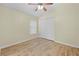 Bedroom with ceiling fan and double door closet at 12922 Saulston Pl, Hudson, FL 34669