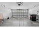 Attached garage with open overhead door and concrete floor at 12922 Saulston Pl, Hudson, FL 34669