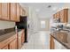 Modern kitchen with stainless steel appliances and ample cabinet space at 12922 Saulston Pl, Hudson, FL 34669