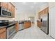 Kitchen with stainless steel appliances and granite counters at 12922 Saulston Pl, Hudson, FL 34669