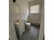 White tiled bathroom with bathtub, toilet, and sink at 1311 11Th S Ave, St Petersburg, FL 33705