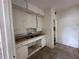 Small kitchen with white cabinets and double sink at 1311 11Th S Ave, St Petersburg, FL 33705