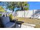 Private backyard with patio furniture and fenced yard at 1311 Powderpuff Dr # 1003, Dunedin, FL 34698