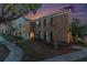 Brick townhouse with landscaping, located on a quiet street at 13716 Orange Sunset Dr, Tampa, FL 33618