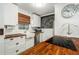 Modern white kitchen with butcher block countertops and farmhouse sink at 13716 Orange Sunset Dr, Tampa, FL 33618