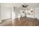 Bright and airy living room with wood-look floors and ceiling fan at 13716 Orange Sunset Dr, Tampa, FL 33618