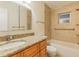 Bathroom with granite countertop, bathtub and tiled walls at 13851 102Nd Ave, Largo, FL 33774