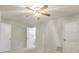 Bedroom with ceiling fan, neutral walls, and access to bathroom at 13851 102Nd Ave, Largo, FL 33774