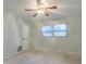 Bright bedroom with ceiling fan, large window and neutral walls at 13851 102Nd Ave, Largo, FL 33774