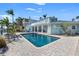 Relaxing pool area with patio furniture and waterfront views at 17077 Dolphin Dr, North Redington Beach, FL 33708