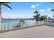 Spacious deck overlooking the water with white railing at 17077 Dolphin Dr, North Redington Beach, FL 33708