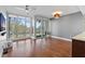 Living room with hardwood floors and sliding glass doors to balcony at 175 1St S St # 211, St Petersburg, FL 33701