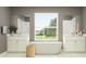 Elegant bathroom with double vanities, a freestanding tub, and lots of natural light at 18168 Serene Lake Loop, Lutz, FL 33548