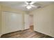 Spacious bedroom with wood-look floors and a ceiling fan at 18809 Chaville Rd, Lutz, FL 33558