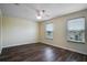 Bright bedroom with wood-look floors and two large windows at 18809 Chaville Rd, Lutz, FL 33558