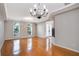 Bright dining room with hardwood floors and a chandelier at 18809 Chaville Rd, Lutz, FL 33558