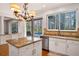 Kitchen with granite island, stainless steel appliances, and a view of the pool at 18809 Chaville Rd, Lutz, FL 33558