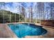 Enjoy this screened pool and spa with a view of the trees at 18809 Chaville Rd, Lutz, FL 33558