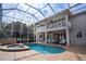 Large screened pool and spa with plenty of seating at 18809 Chaville Rd, Lutz, FL 33558