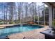 Inviting screened pool and spa with a tranquil backyard view at 18809 Chaville Rd, Lutz, FL 33558