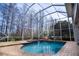 Enclosed pool and spa with a lake view at 18809 Chaville Rd, Lutz, FL 33558