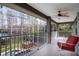 Relaxing screened balcony overlooking the pool and lake at 18809 Chaville Rd, Lutz, FL 33558