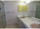 Double vanity bathroom with shower and mirror at 19029 Us Highway 19 N # 23C, Clearwater, FL 33764