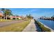 Waterfront community with paved pathways and tropical landscaping at 19029 Us Highway 19 N # 23C, Clearwater, FL 33764