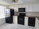 Kitchen features black appliances and granite countertops at 19029 Us Highway 19 N # 23C, Clearwater, FL 33764