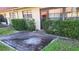 Small brick patio area with well-maintained hedges at 19029 Us Highway 19 N # 23C, Clearwater, FL 33764