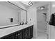 Bathroom with a large vanity and a shower with modern fixtures at 20 Sylvia Pl, Oldsmar, FL 34677