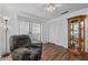 Relaxing bedroom with wood floors and built-in shelving at 20 Sylvia Pl, Oldsmar, FL 34677