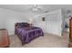 Cozy bedroom with purple bedding and ample closet space at 20 Sylvia Pl, Oldsmar, FL 34677