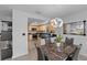 Elegant dining area with marble table and modern light fixture at 20 Sylvia Pl, Oldsmar, FL 34677