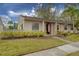 Exterior view of a charming condo with well-manicured landscaping and carport at 20 Sylvia Pl, Oldsmar, FL 34677